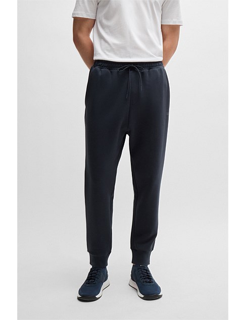 Logo-print tracksuit bottoms in stretch cotton